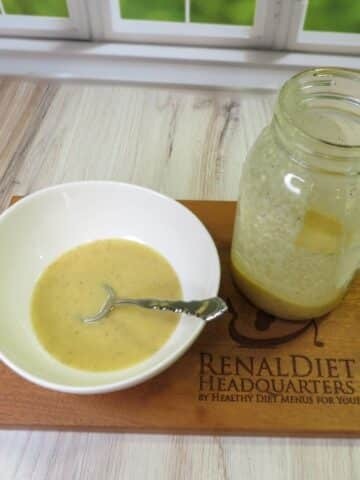 Caesar Dressing No Anchovies in a bowl with a spoon ready to be enjoyed.