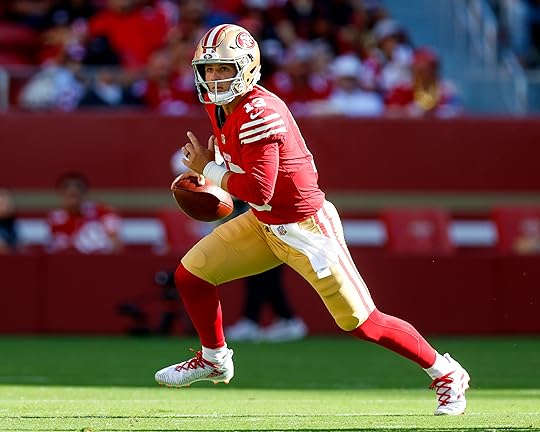 San Francisco 49ers starting quarterback Brock Purdy (13) scrambles against...