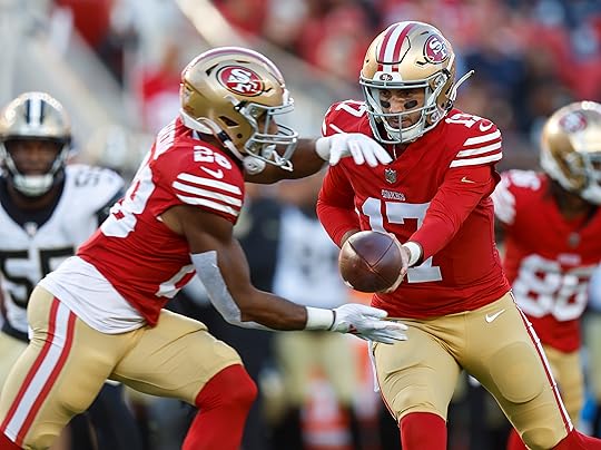 San Francisco 49ers quarterback Brandon Allen (17) hands the ball...