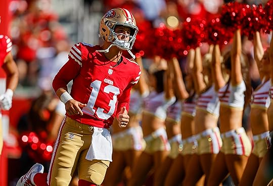 San Francisco 49ers starting quarterback Brock Purdy (13) heads onto...