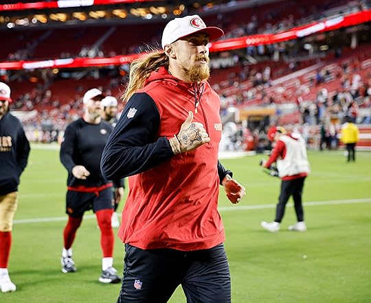 San Francisco 49ers’ George Kittle (85) heads off the field...