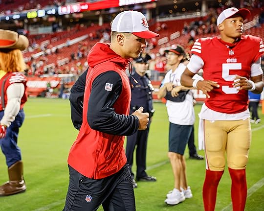 San Francisco 49ers starting quarterback Brock Purdy (13) heads off...