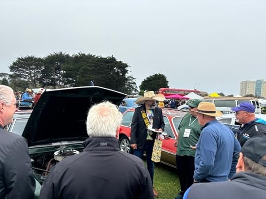 Ray Montoya presenting his 1969 AMC AMX to Concours d'Lemons judges Saturday morning. (Andrea Valadez - Monterey Herald)