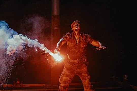Mahershala Ali yells while holding a flare in Jurassic World Rebirth.