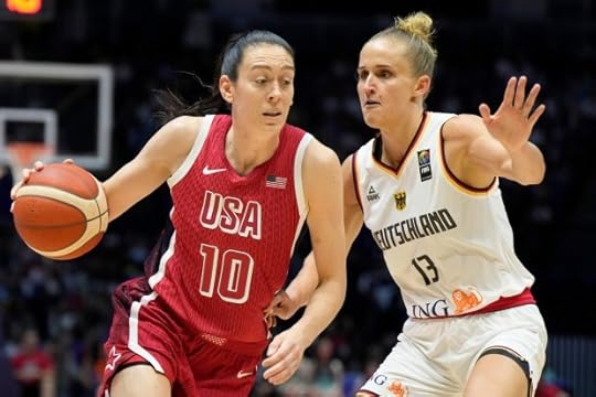 United States' Breanna Stewart, left, drives around Germany's Leonie Fiebich during a women's exhibition basketball game between the United States and Germany at the O2 Arena in London, Tuesday, July 23, 2024. (AP Photo/Alastair Grant)