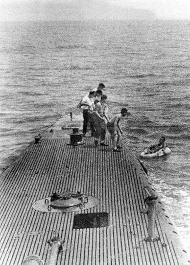 Crew of USS Finback pulling downed airman Lieutenant (jg) George Bush from the water off Chichi Jima, Bonin Islands, 2 Sep 1944 (Photo: George Bush Presidential Library and Museum)