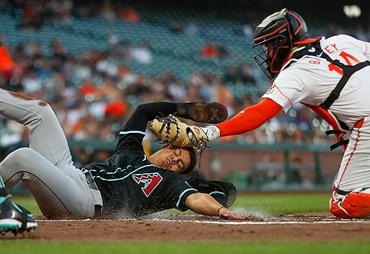 Arizona Diamondbacks’ Jorge Barrosa (1) scores a run off of...