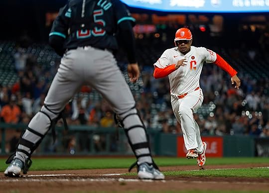 San Francisco Giants’ LaMonte Wade Jr. (31) scores a run...