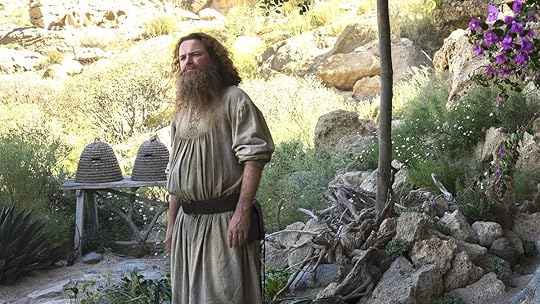 Rory Kinnear as Tom Bombadil standing outside on The Rings of Power