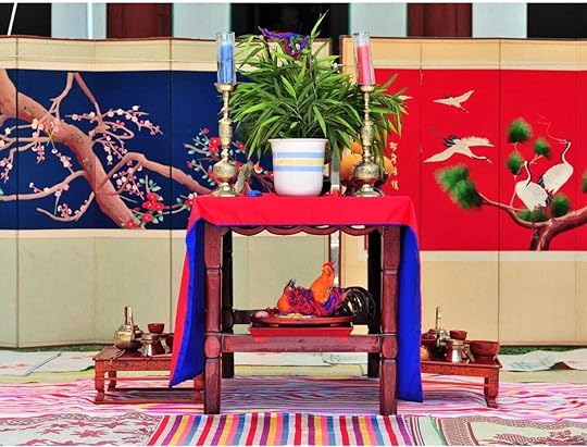 A male and female chicken wrapped in a blue and red silk cloth represent the natural powers and duality of Ying and Yang 