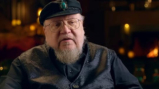 George RR Martin in his famous hat sitting