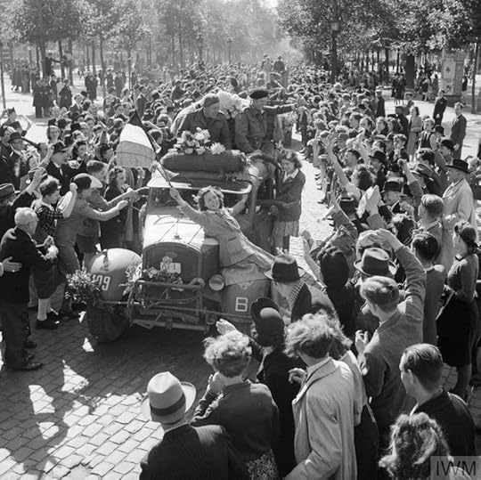 Civilians celebrate as British vehicles enter Brussels, 4 September 1944 (Imperial War Museum: BU 482)