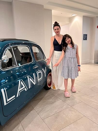 The lobby of Hotel Landy with the miniature teal car that says