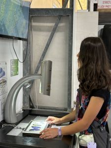 What do you want to do? A girl demonstrates a microscope