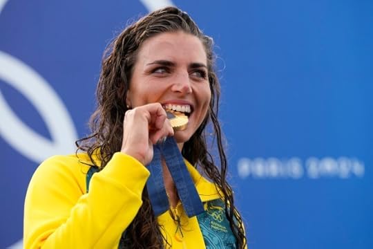 Australia's Jessica Fox gold medalist in the women's kayak single poses with her medal during the canoe slalom at the 2024 Summer Olympics, Sunday, July 28, 2024, in Vaires-sur-Marne, France. (AP Photo/Kirsty Wigglesworth)