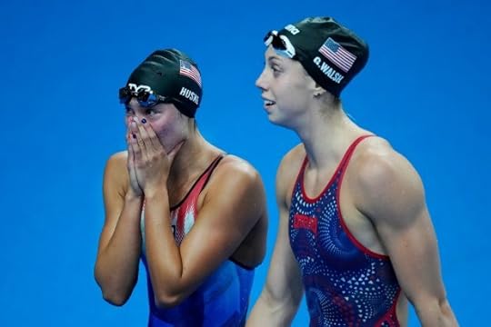 Torri Huske, left, of the United States, reacts after winning the women's 100-meter butterfly final with teammate Gretchen Walsh at the 2024 Summer Olympics, Sunday, July 28, 2024, in Nanterre, France. (AP Photo/Petr David Josek)