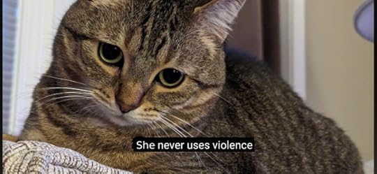 A second photo of Willabee. She is now looking directly at the camera and the caption at the bottom of the photo reads: "She never uses violence"