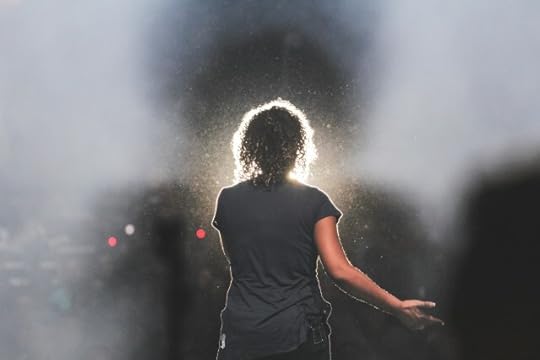 A person opening up, stepping out of shadow. What does it really mean to let go?