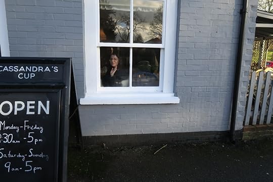Eleanor seen through the window of Cassandra's Cup