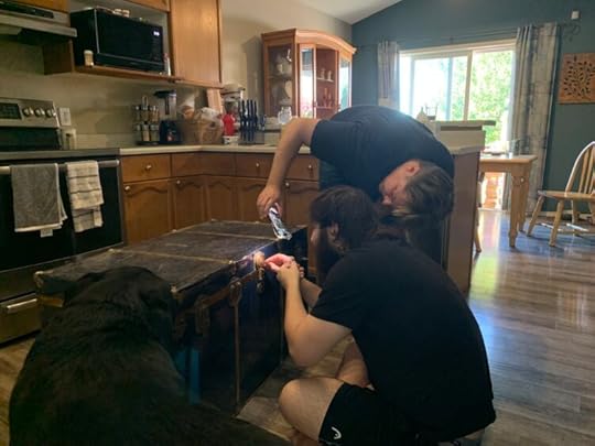 Tech Support and crew attempt to pick the lock on a 60-year-old trunk