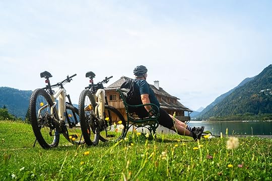 european bike tours - guy on bench at lake
