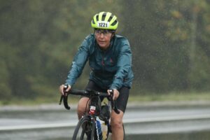 Female cyclist riding in the rain