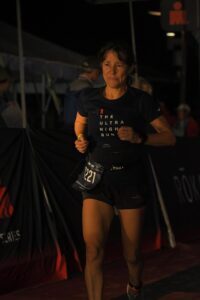 Female runner crying at finish line of a race
