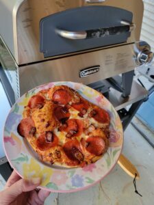 Picture of pizza with Cuisinart 3 in 1 pizza oven, grill and griddle.