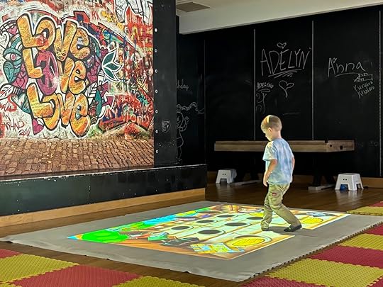 a boy walking on a carpet
