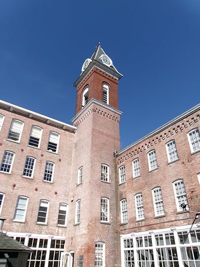 MASS MoCA entrance, brick buildings with a clock tower in the corner