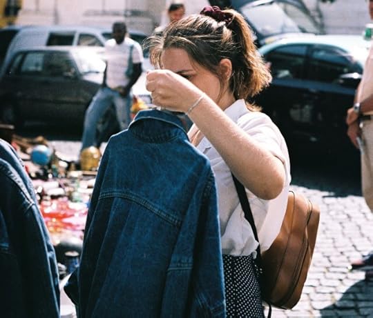 Woman selecting a shirt. Once size never fits all.