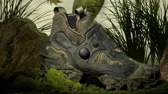 Reebok shoe with algae and muddy print on swamp background.