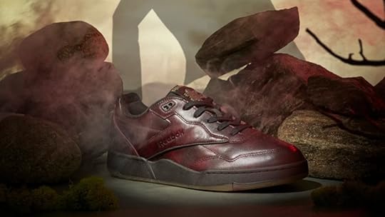 Reebok Dracula shoe with monster in the background.