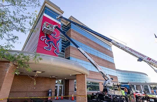 Raptor mascot sign being installed