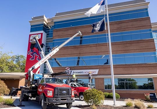 Both signs being installed