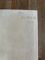 Handwritten note in ink in the inside page of a book: "Ann from Uncle John 12.7.38"