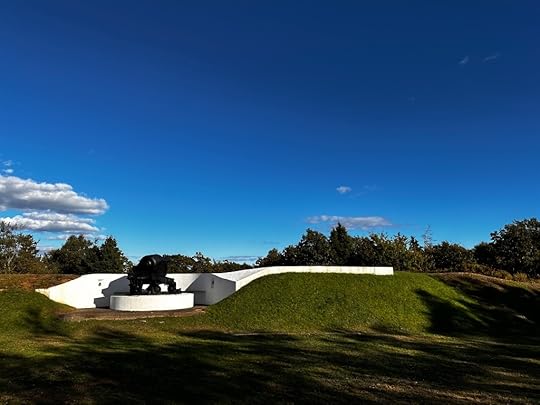 Green grass, blue sky, and a cannon