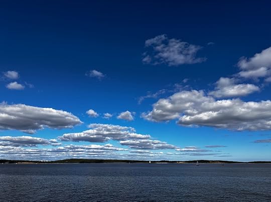 View of McNabs Island from York Redoubt on a sunny day: sea, sky, island, lighthouse