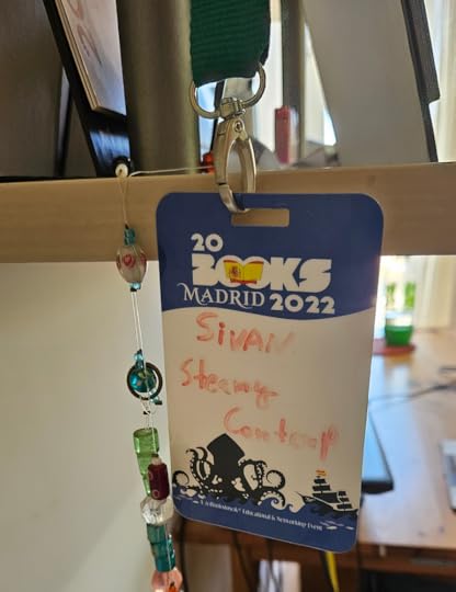 The image shows a lanyard badge from the 