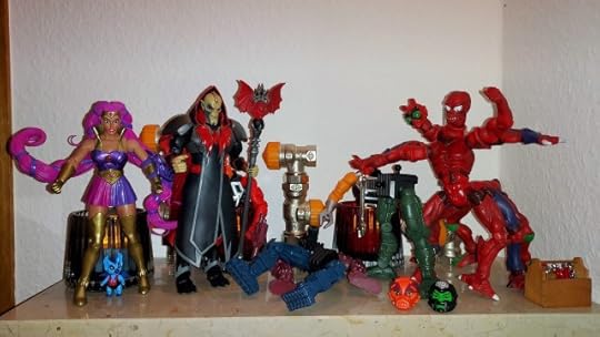 Hordak, Imp and Entrapta arrive in Modulok's lab to see his latest invention.