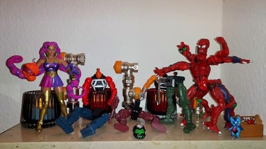 Entrapta holds one of the Multi-Bot heads, while Modulok freaks out and Imp looks on.
