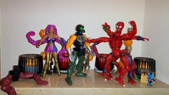 Modulok fixes one half of Multi-Bot, while Entrapta and Imp look on.