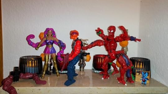 Entrapta assembles the other half of Multi-Bot, while Modulok is incensed that she gave him a tail.