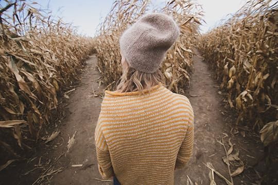 Woman looking at two divergent paths.