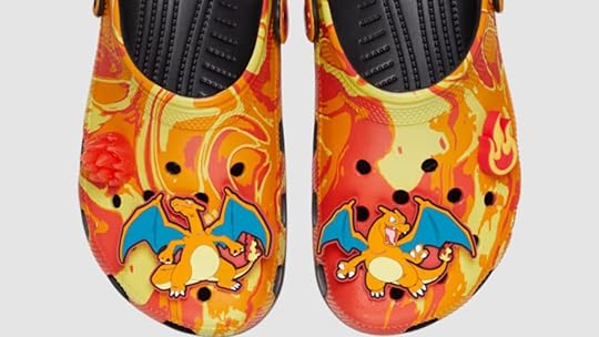 Charizard Crocs with firey print and Charizard Jibbitz