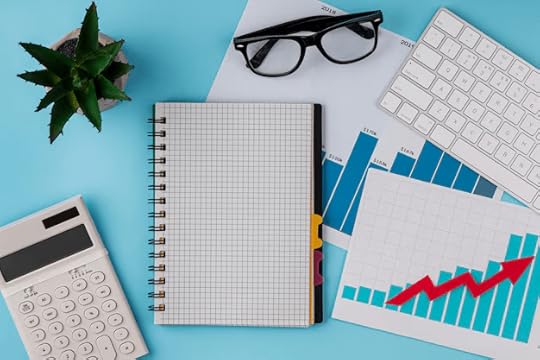 tax preparation notebook and glasses