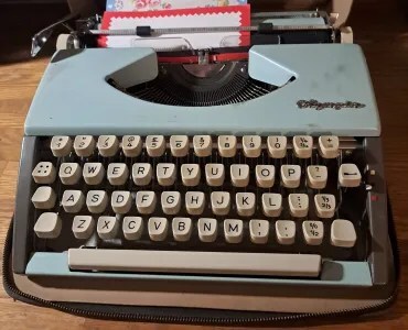 close-up of typewriter in open travelling case