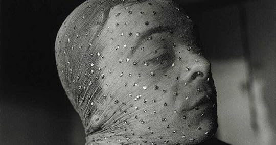 A black and white photograph of Indiana with a sparkling or sequined veil around his head. I don't know who the photographer is.