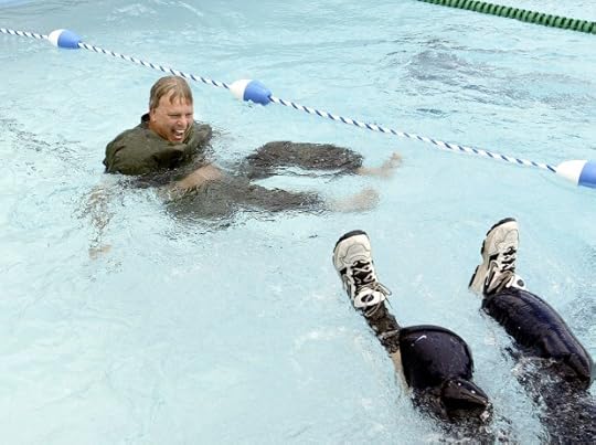 CSUMB President Peter Smith was pulled into CSUMB's new pool by Athletic Director Bill Trumbo at the dedication ceremony in 2003. (Vern Fisher, Monterey Herald Archive)