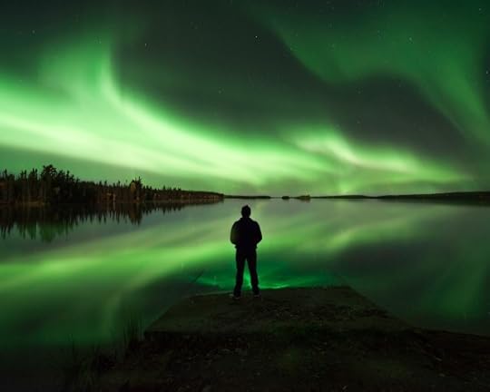 A person pausing to watch the Northern Lights. Not selfish.